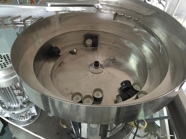 sistema de alimentação vibratória de tampas.jpg