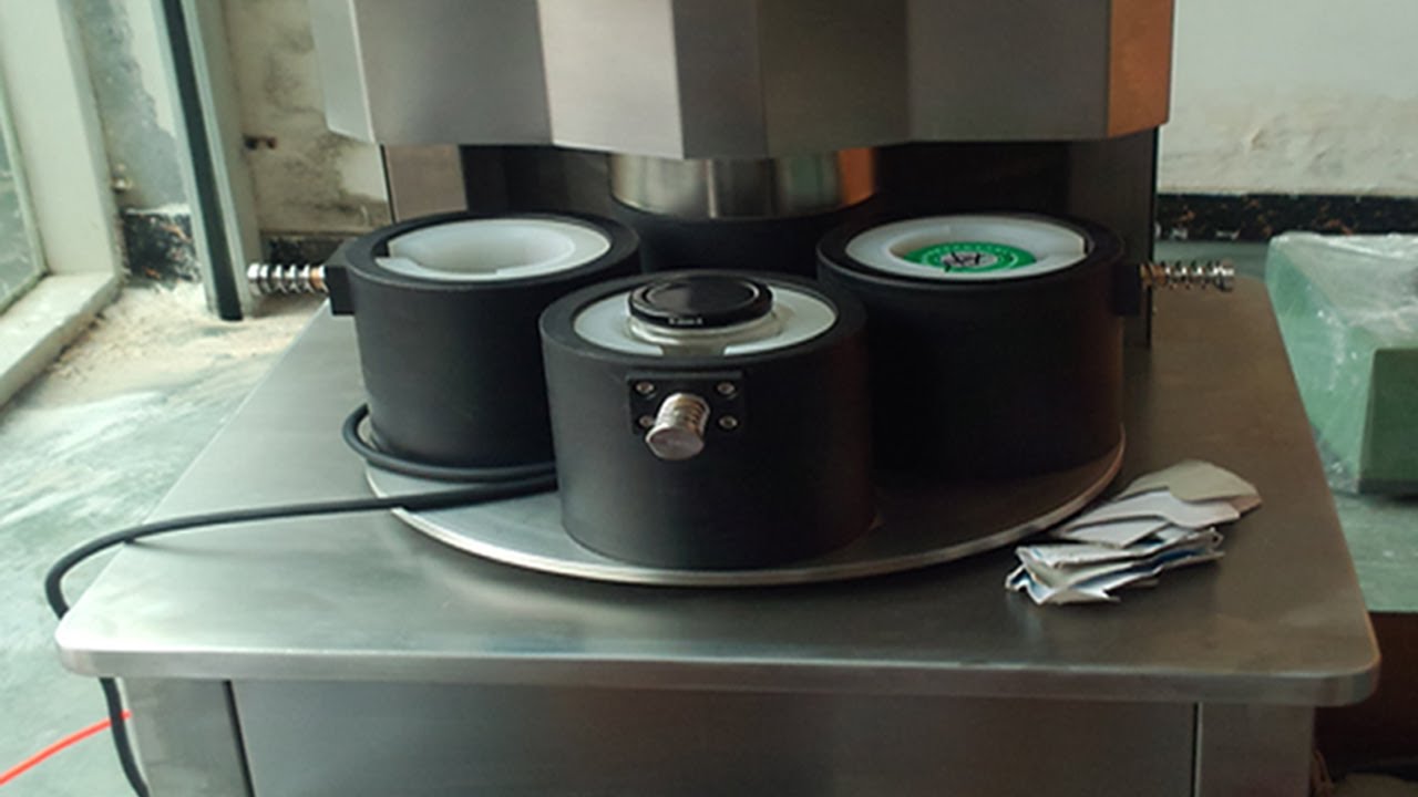 four heads vacuum capping machine semi automatic manual de tampadora a vácuo.jpg