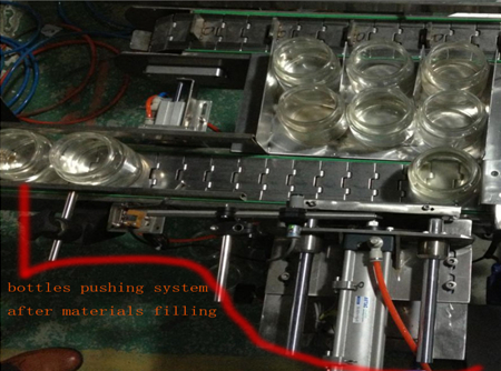 automatic bottles pushing system after filing sistema de empurrar garrafas.jpg
